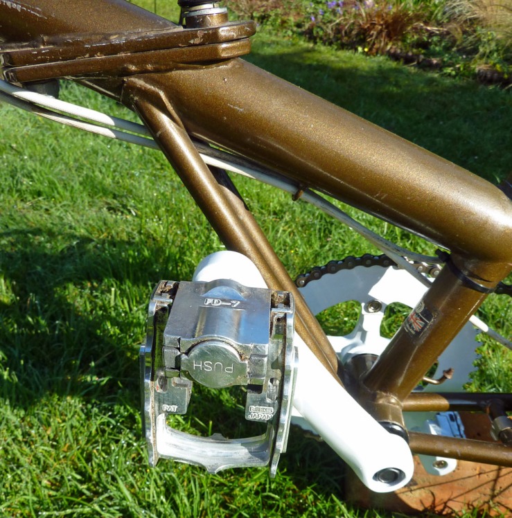 Another view of the folded pedal, with the frame hinge at top left.